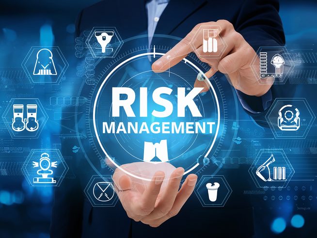 man is holding tablet with blue screen that says risk it